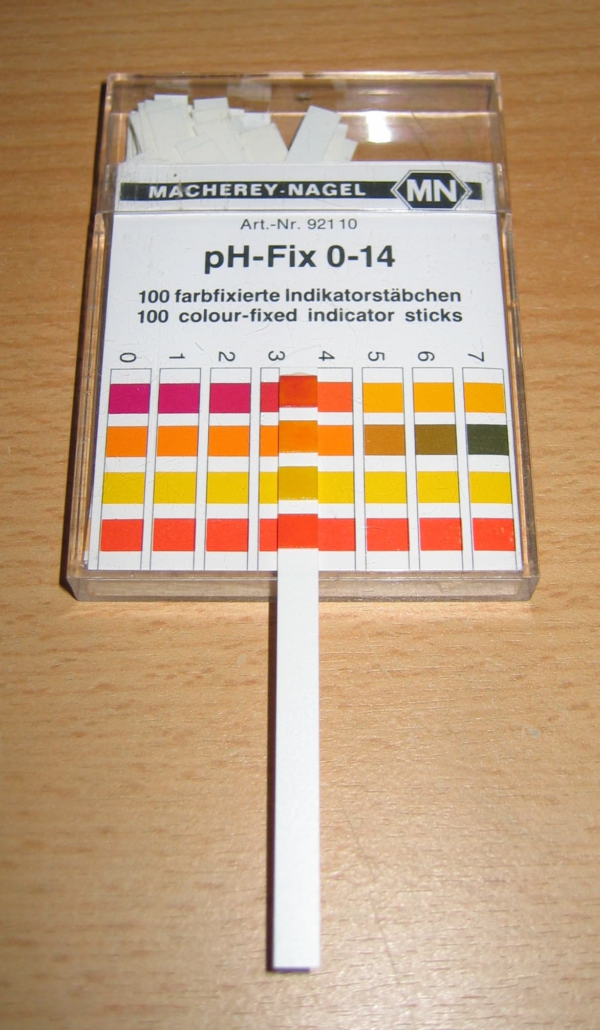 pH indicator paper showing a color change used to estimate acidity