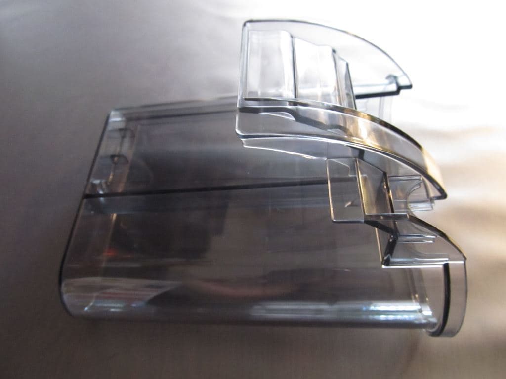 Slim hang-on-back aquarium filter mounted on a glass tank rim